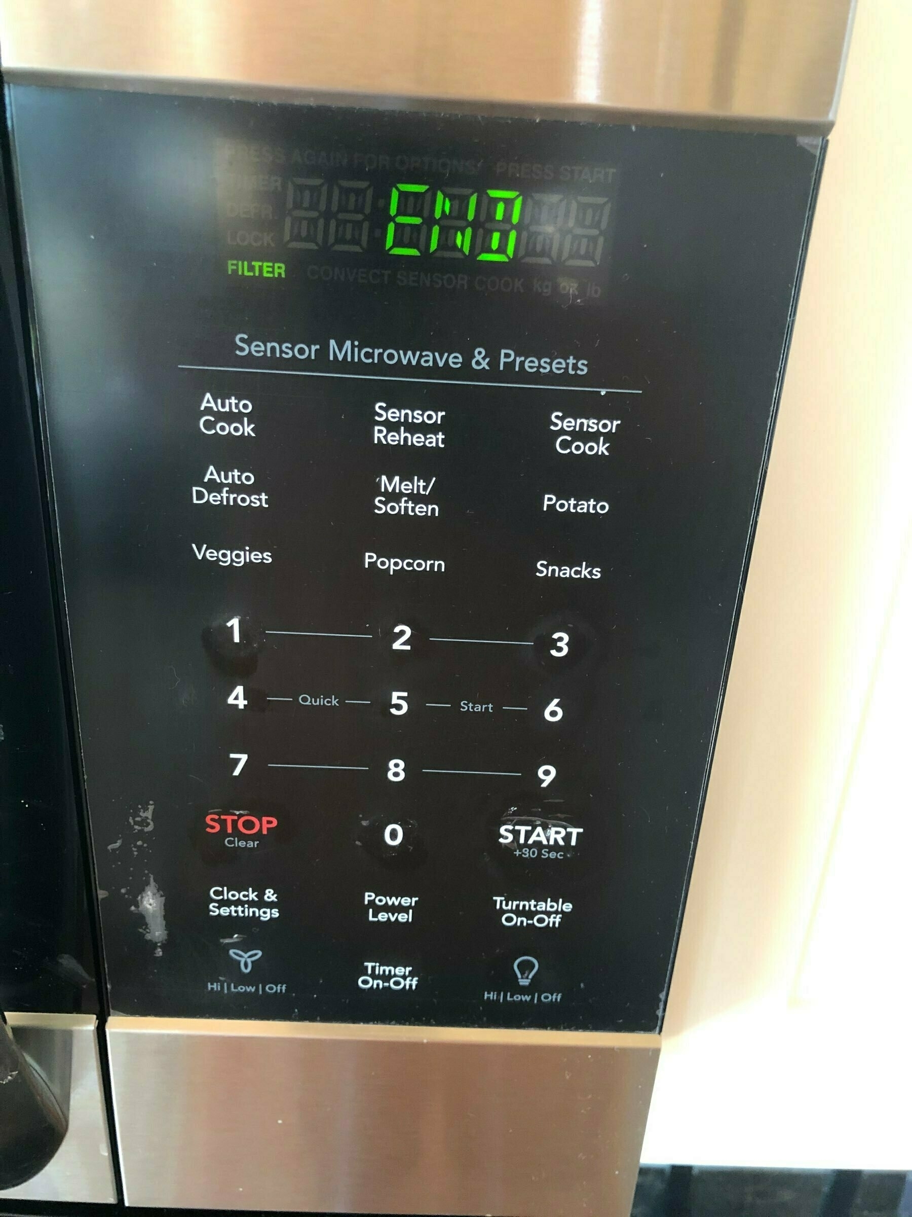 microwave keypad and  digital screen saying "end"