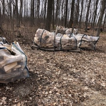 several white bags of firewood