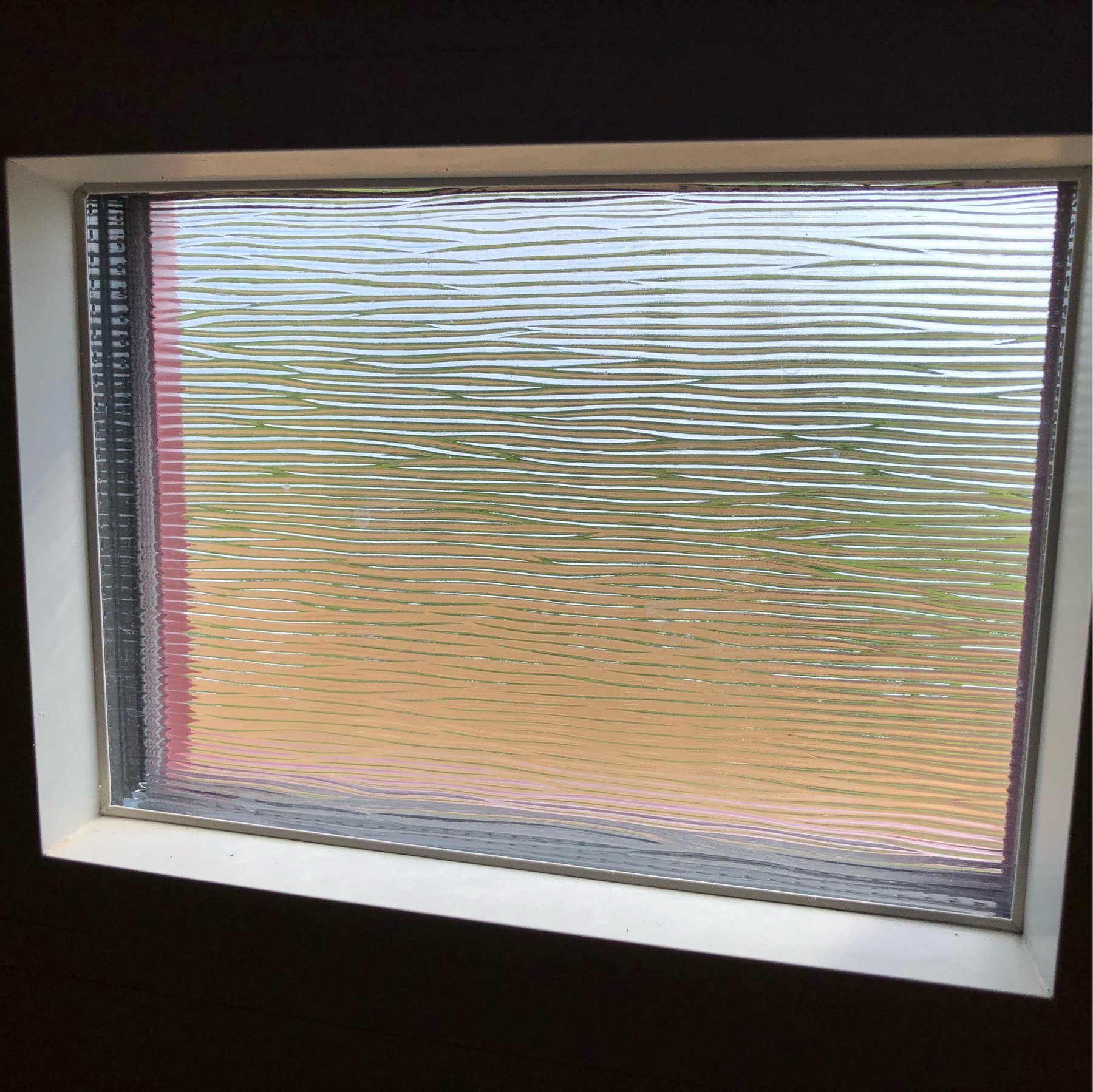 small window with wavy, horizontal lines