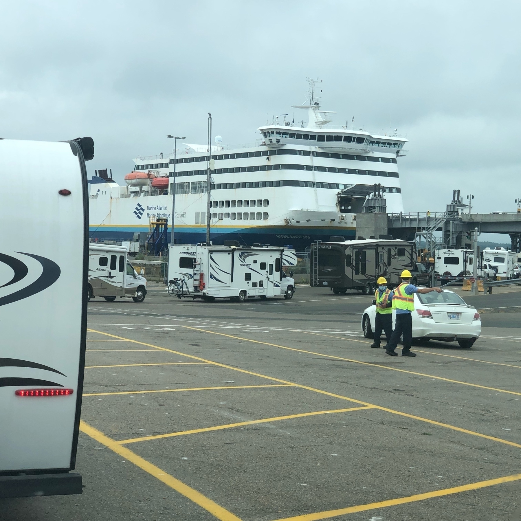 R Vs lined up to enter a large ferry