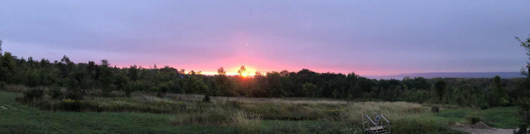 the sun appears over the horizon