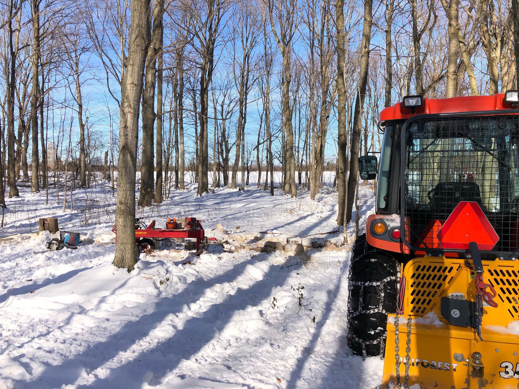 tractor with logging winch and wood splitter