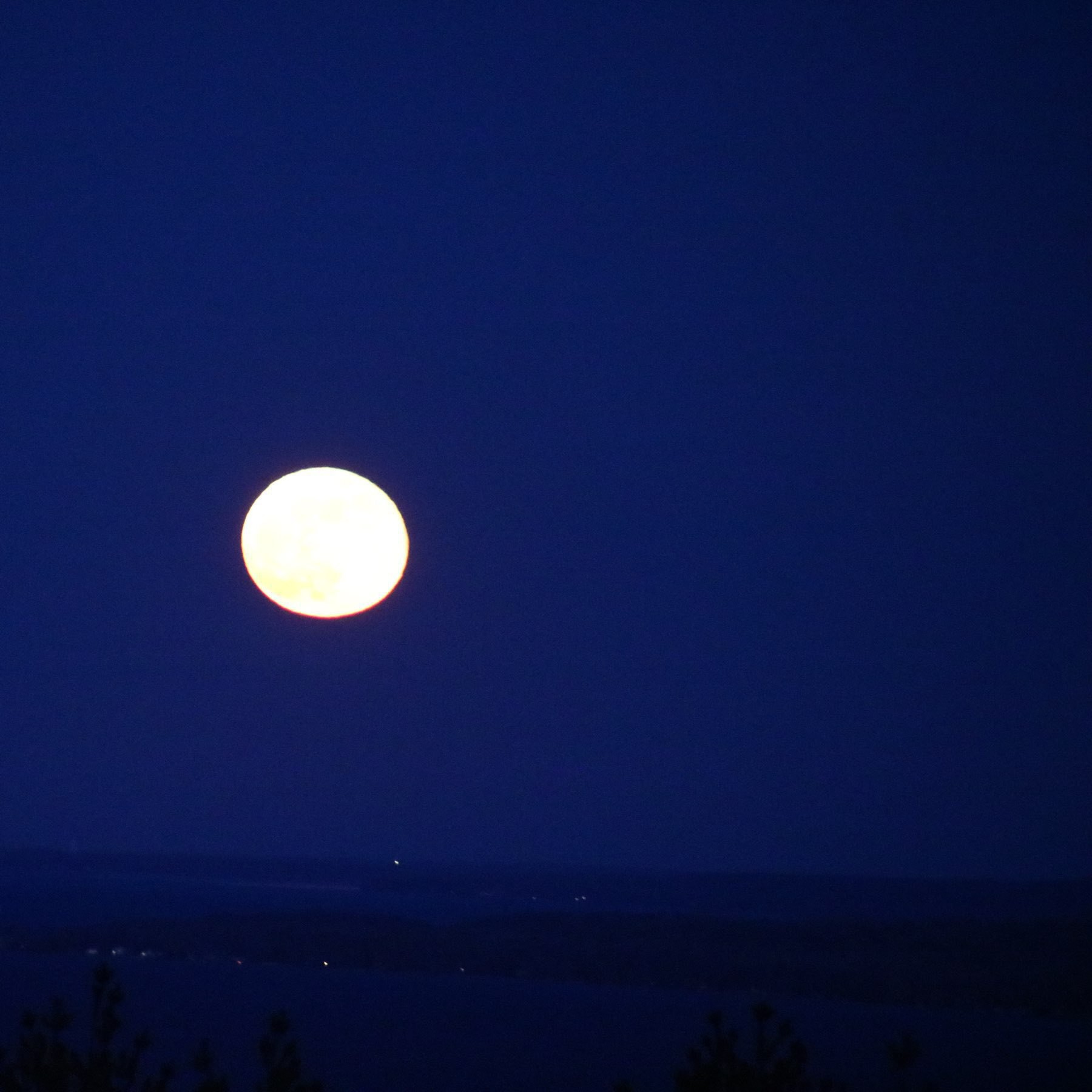 full moon in a darkened sky