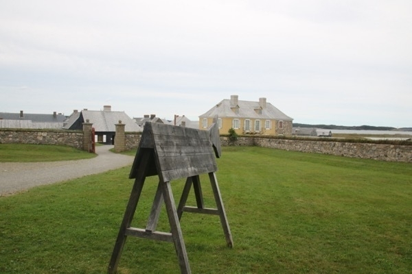 wooden horse made with wide lumber joined at a sharp angle on top