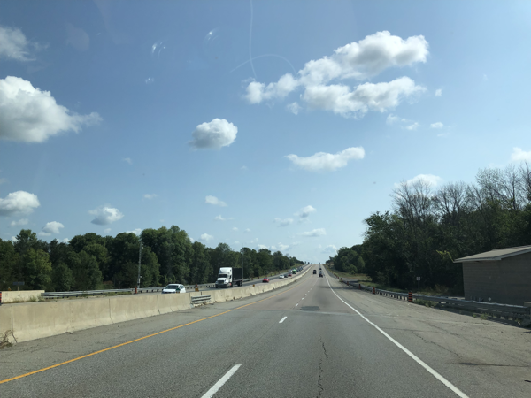 highway 401 with little traffic in the direction of travel and a few vehicles in the oncoming lanes